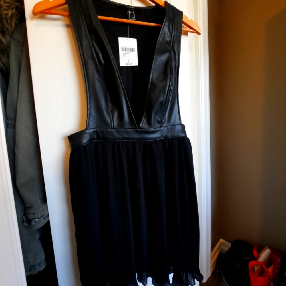 Extreme low front cut faux leather dress